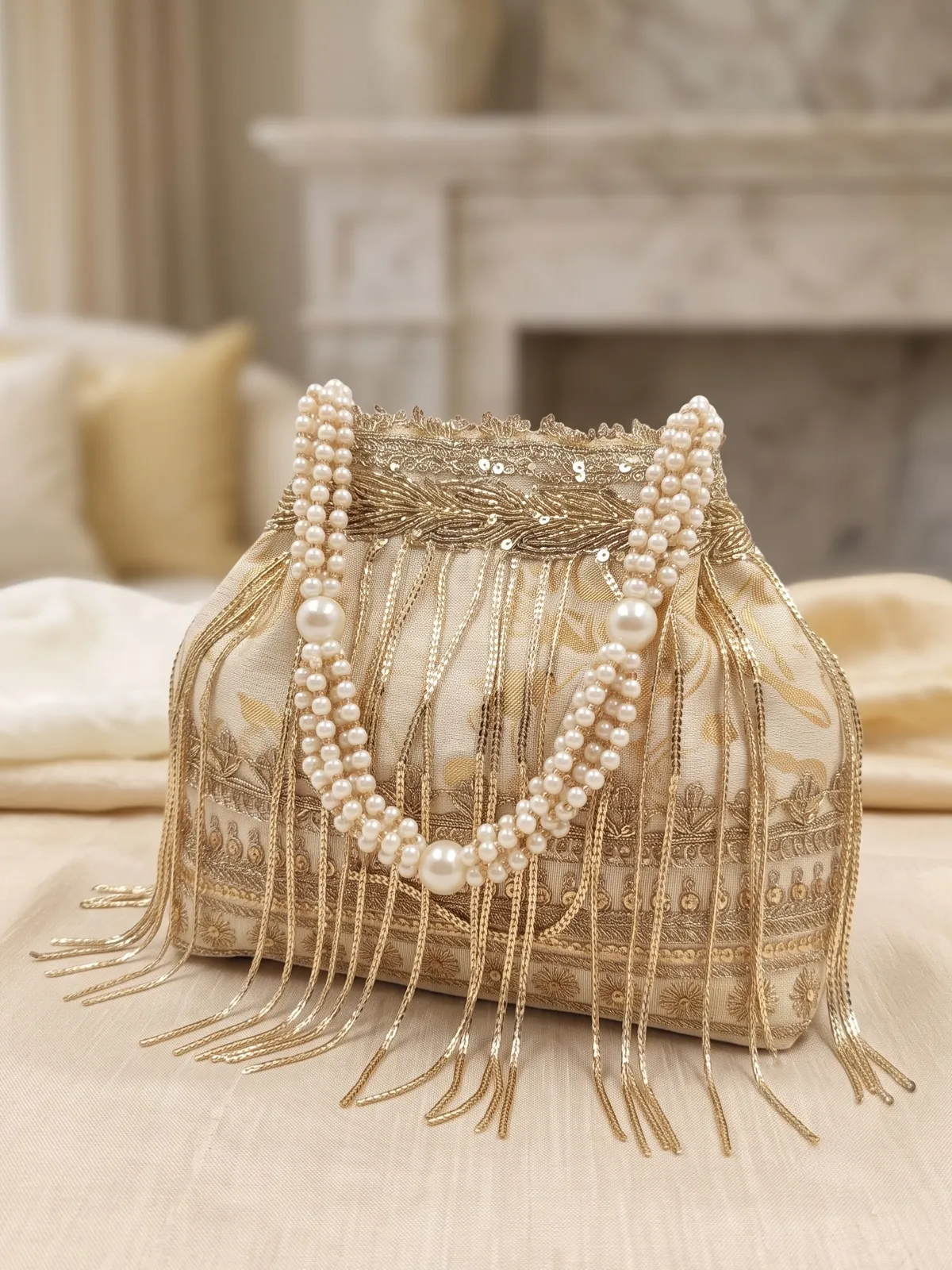 Elegant Gold Embroidered Potli Bag with Fringes