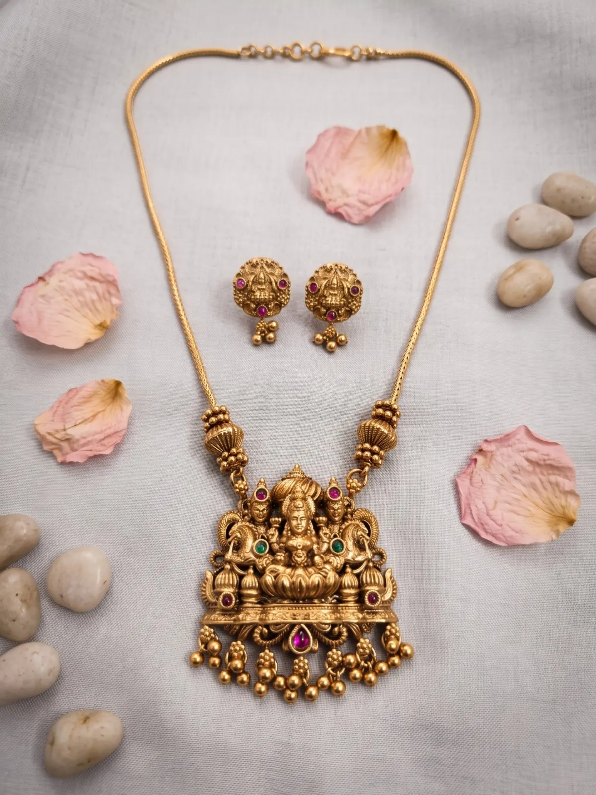 Divine Lakshmi Motif Antique Gold Pendant Set with Matching Stud Earrings