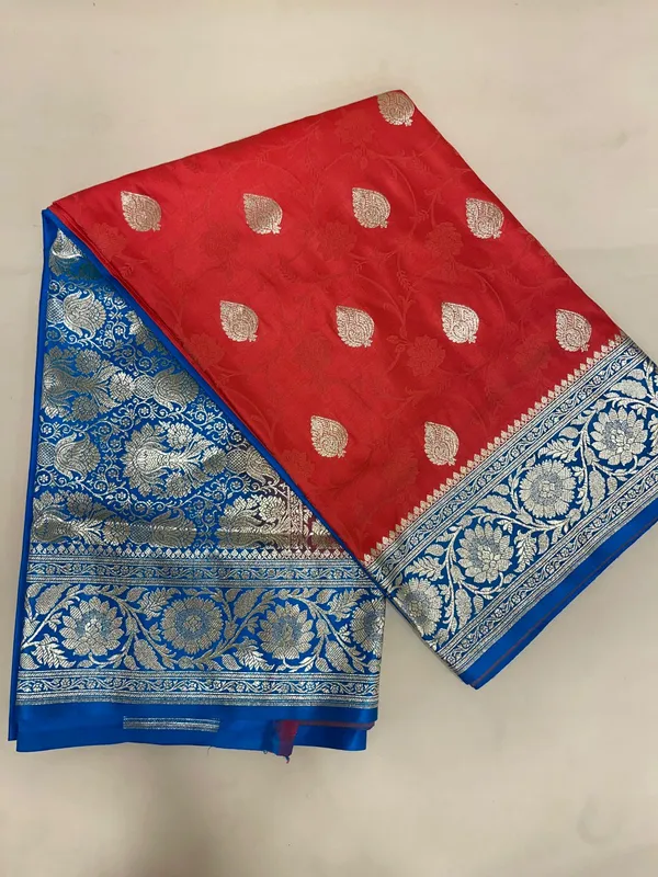 Humairah_Presents_Red_Satin_Silk_Silver_Zari_Booti_Mina_Jaal_Banarasi_saree_and_Contrast_Blue_Silver_Zari_Boota_Pallu_with_Blue_Blouse
