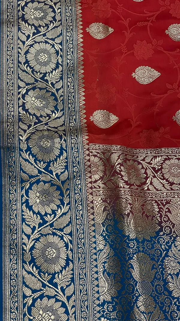 Humairah_Presents_Red_Satin_Silk_Silver_Zari_Booti_Mina_Jaal_Banarasi_saree_and_Contrast_Blue_Silver_Zari_Boota_Pallu_with_Blue_Blouse