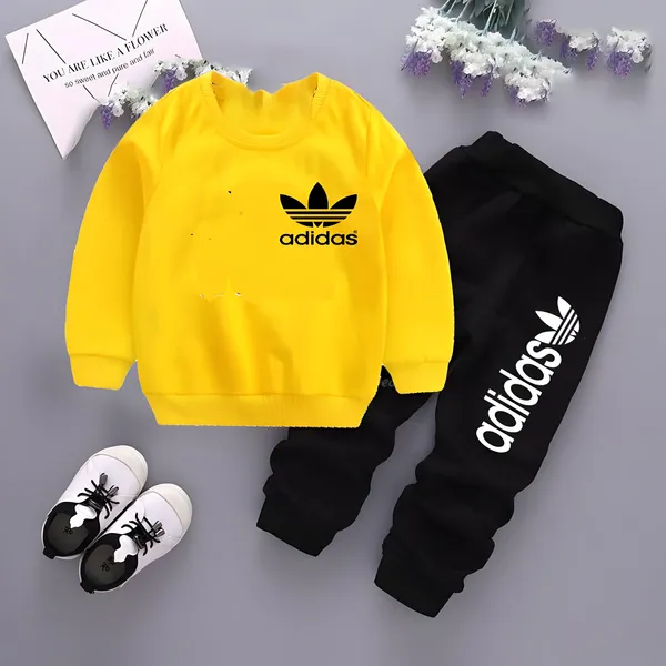 https://d1311wbk6unapo.cloudfront.net/NushopCatalogue/tr:f-webp,w-600,fo-auto/28-Adidas_Small-Yellow_1700577033897_8lqem84kkezrflt.jpg__Modern Minnies