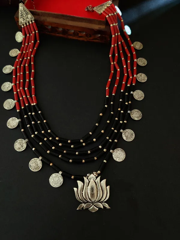 Utpala_Multi-Layered_Red_and_Black_Beaded_Necklace_with_Silver_Lotus_Pendant