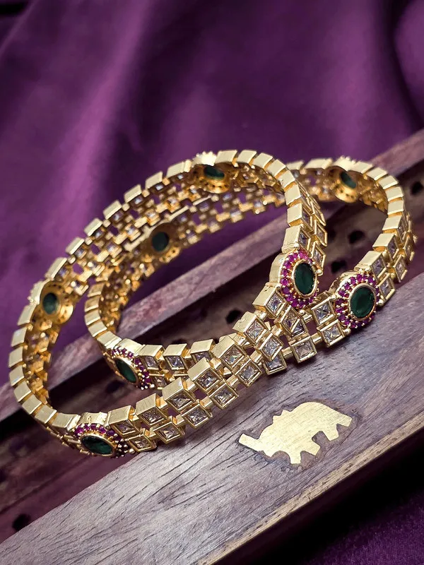 Gold-Tone_Bangle_with_Green_Gem