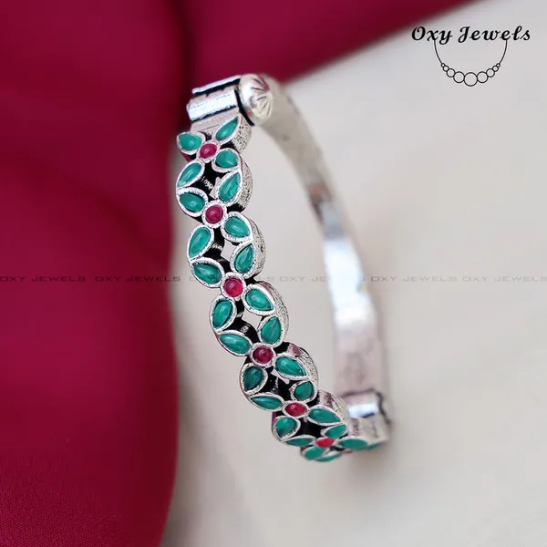 Elegant_Silver_Floral_Bangle_with_Green_and_Pink_Gemstones_-_Oxy_Jewels