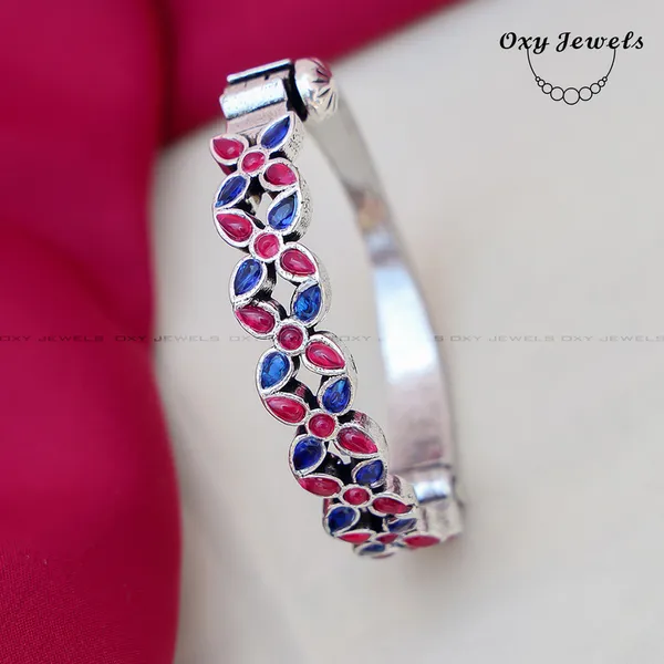 Elegant_Silver_Bracelet_with_Red_and_Blue_Gemstones_-_Oxy_Jewels