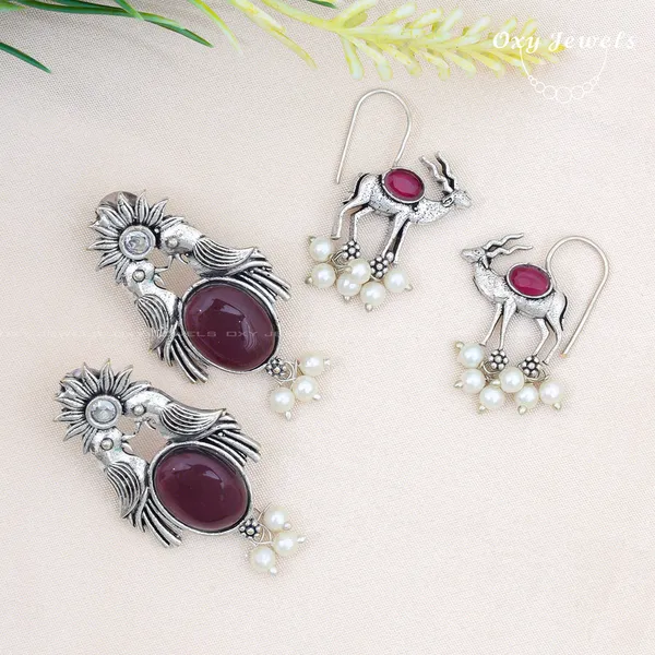 Pack_of_2_-_Oxidised_Silver_Peacock_and_Deer_Earrings_with_Maroon_Stones_and_Pearl_Accents