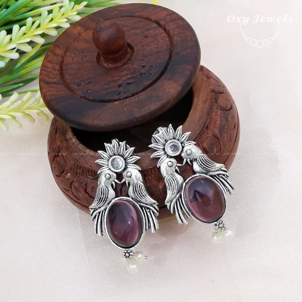Pack_of_2_-_Oxidised_Silver_Peacock_and_Deer_Earrings_with_Maroon_Stones_and_Pearl_Accents