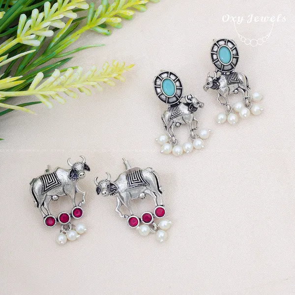 Pack_of_2_-_Oxidised_Silver_Bull_Earrings_with_Turquoise_and_Ruby_Accents