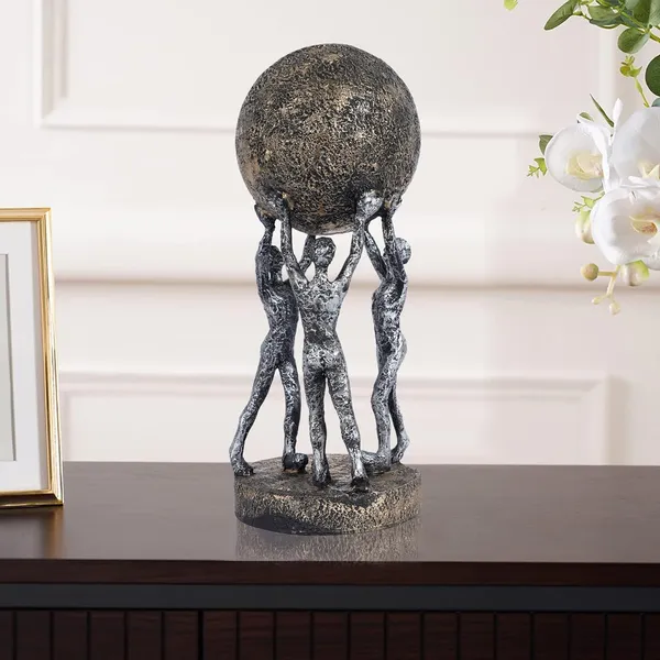 Men_Group_Carrying_Earth_Showpiece_of_Grey_and_Golden_Color_|_Elegant_Touch_on_Home_Decor