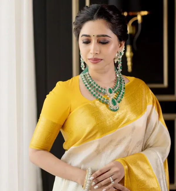 Designer_Cream_Soft_Banarasi_Silk_Saree_With_Surpassing_Blouse_Piece