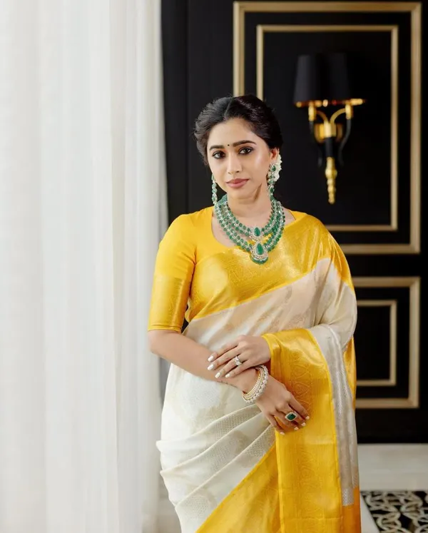 Designer_Cream_Soft_Banarasi_Silk_Saree_With_Surpassing_Blouse_Piece