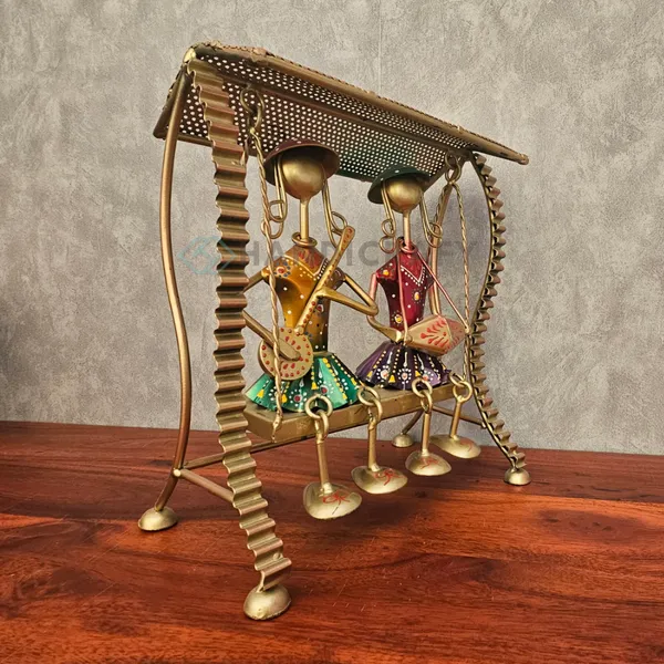 Handcrafted_Gold-Tone_Musical_Swing_Figurine_with_Colorful_Tribal_Accents