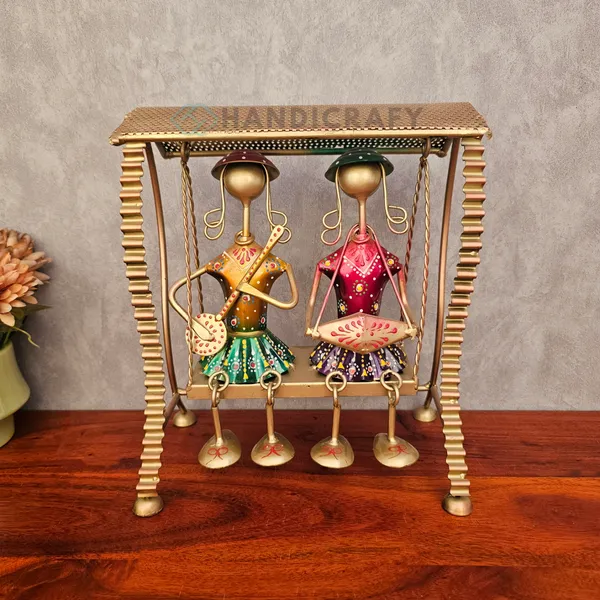 Handcrafted_Gold-Tone_Musical_Swing_Figurine_with_Colorful_Tribal_Accents