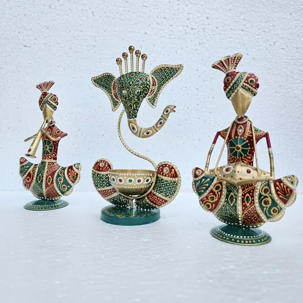 Handcrafted_Metal_Rajasthani_Tribal_Musician_Sitting_Showpiece_with_Ganesh_Urli_Diya_Set_of_3_(9_Inch)