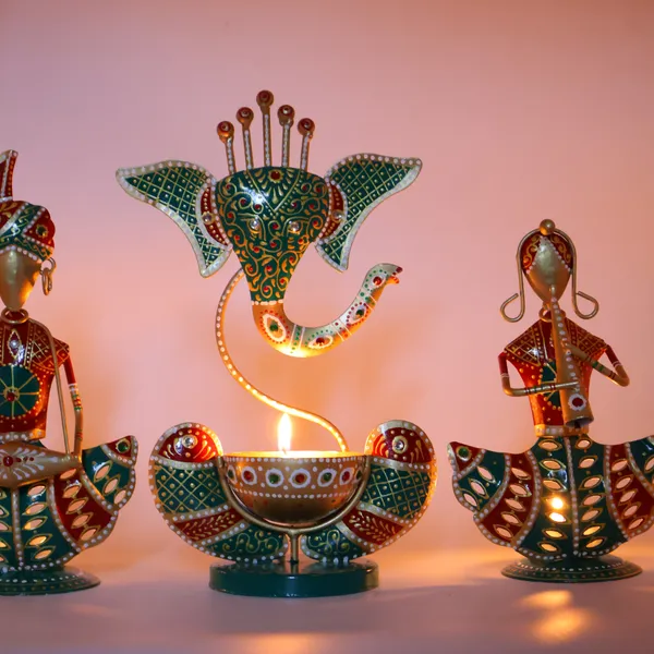 Metal_Rajasthani_Tribal_T-light_Musician_Sitting_Showpiece_with_Ganesh_Diya_Set_of_3_(11_Inch)