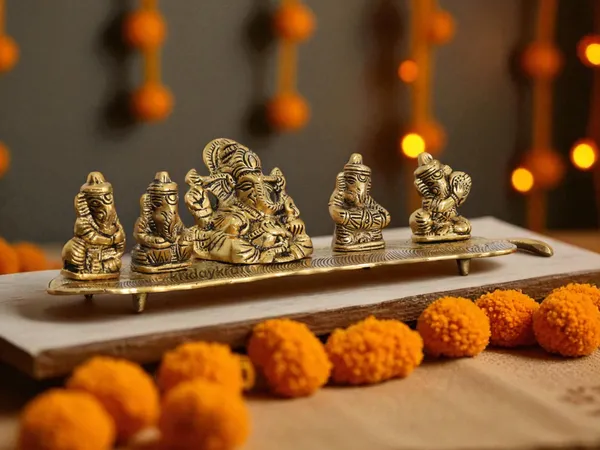 White_Metal_Gold_Plated_Ganesha_On_Leaf_With_Musical_Instrument_Metal_Statue_For_Pooja