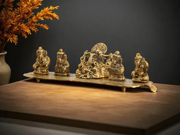 White_Metal_Gold_Plated_Ganesha_On_Leaf_With_Musical_Instrument_Metal_Statue_For_Pooja