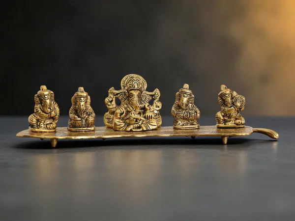 White_Metal_Gold_Plated_Ganesha_On_Leaf_With_Musical_Instrument_Metal_Statue_For_Pooja