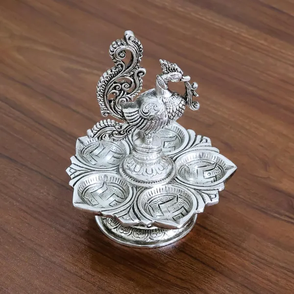 Traditional_Silver-Plated_Peacock_Pooja_Thali,_5-Compartment_Diya_Stand_with_Ornate_Design