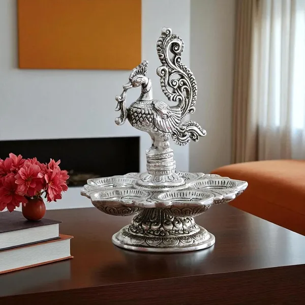 Traditional_Silver-Plated_Peacock_Pooja_Thali,_5-Compartment_Diya_Stand_with_Ornate_Design