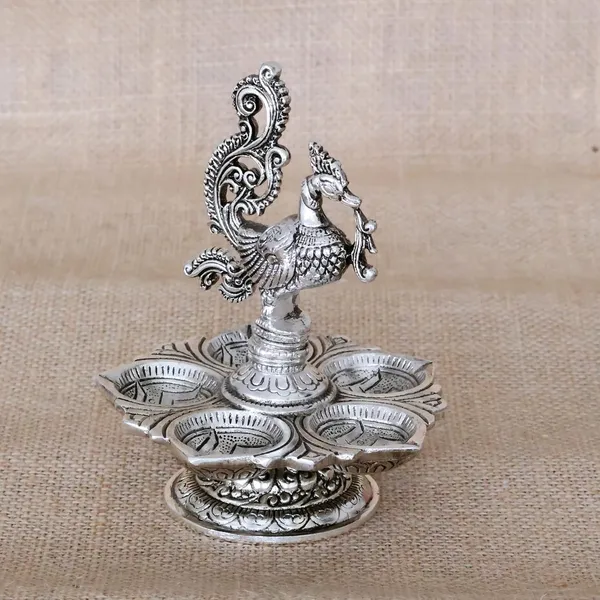 Traditional_Silver-Plated_Peacock_Pooja_Thali,_5-Compartment_Diya_Stand_with_Ornate_Design