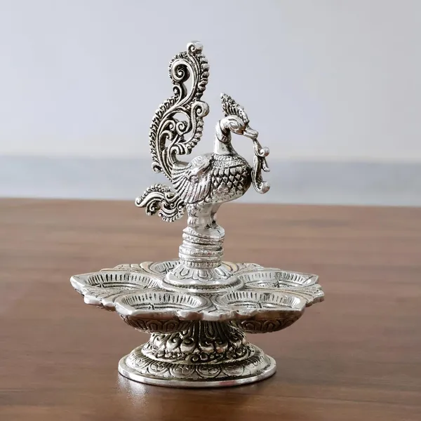 Traditional_Silver-Plated_Peacock_Pooja_Thali,_5-Compartment_Diya_Stand_with_Ornate_Design