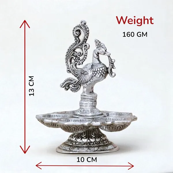 Traditional_Silver-Plated_Peacock_Pooja_Thali,_5-Compartment_Diya_Stand_with_Ornate_Design