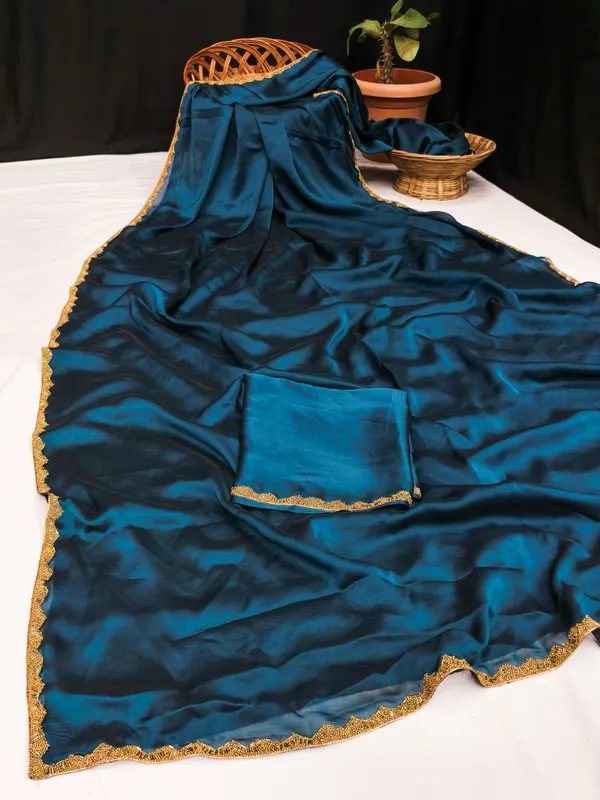 New_Party_Wear_Rangoli_Silk_Rama_color_saree_with_Blouse_and_stone_lace_Border