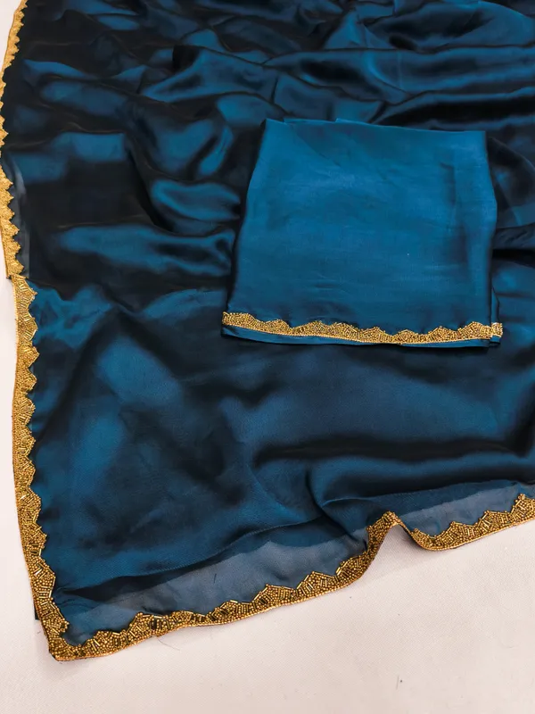 New_Party_Wear_Rangoli_Silk_Rama_color_saree_with_Blouse_and_stone_lace_Border