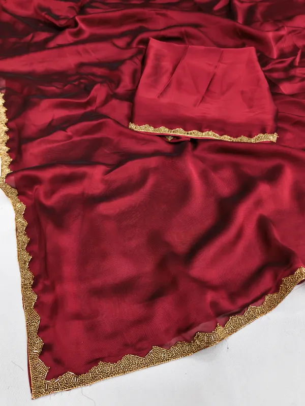 New_Party_Wear_Rangoli_Silk_Maroon_color_saree_with_Blouse_and_stone_lace_Border
