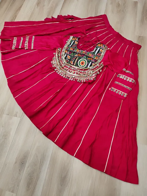 Celebrate_true_Navratri_vibes_with_this_traditional_&_spiritual_outfit_that_beautifully_blends_festive_fun_with_cultural_charm._Choose_from_vibrant_colors_in_this_Lehenga_with_Top,_perfect_for_dancing,_devotion,_and_the_joy_of_togetherness._Comes_with_fully_stitched_lehenga_&_blouse_for_a_ready-to-wear_festive_look._???