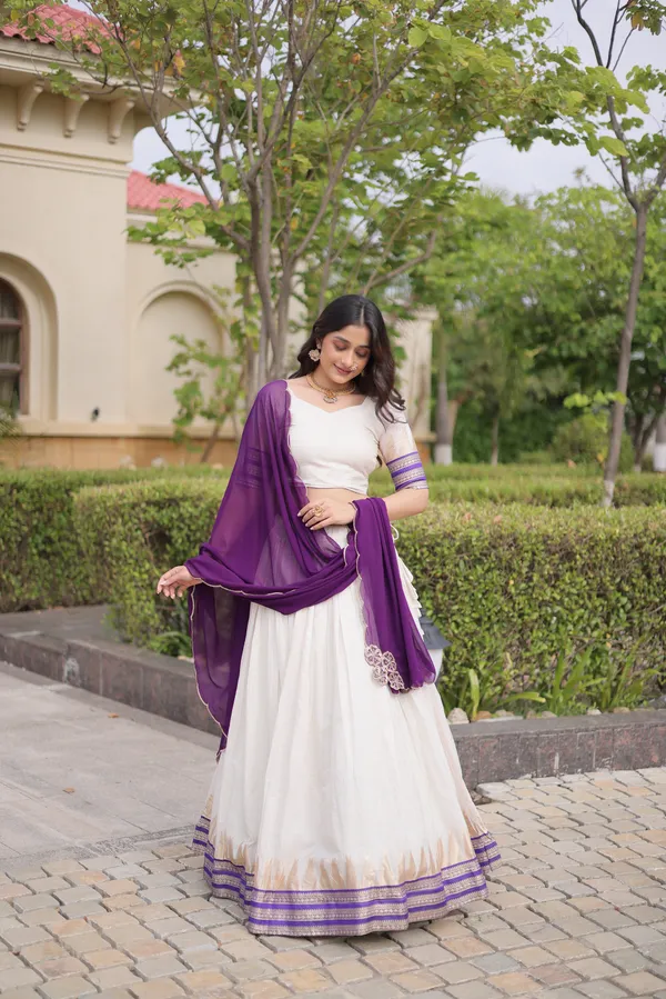 Comfortable_&_lightweight_white_Viscose_Jacquard_Lehenga_Choli_with_Dupatta,_perfect_for_your_Onam_festive_wardrobe._Elegant,_graceful_&_easy_to_wear_�_comes_with_an_unstitched_blouse_for_a_custom_fit.