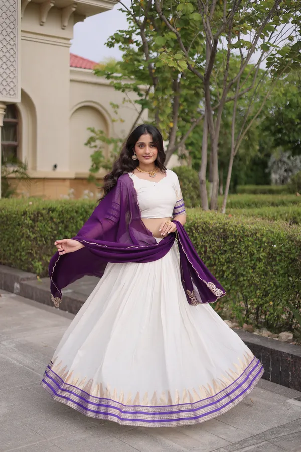 Comfortable_&_lightweight_white_Viscose_Jacquard_Lehenga_Choli_with_Dupatta,_perfect_for_your_Onam_festive_wardrobe._Elegant,_graceful_&_easy_to_wear_�_comes_with_an_unstitched_blouse_for_a_custom_fit.
