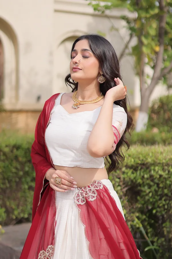 Comfortable_&_lightweight_white_Viscose_Jacquard_Lehenga_Choli_with_Dupatta,_perfect_for_your_Onam_festive_wardrobe._Elegant,_graceful_&_easy_to_wear_�_comes_with_an_unstitched_blouse_for_a_custom_fit.