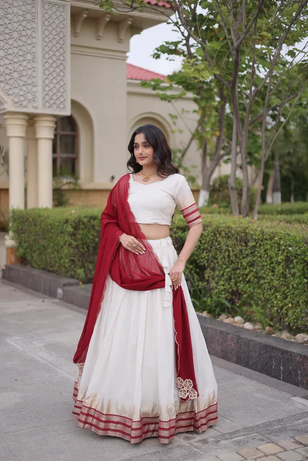 Comfortable_&_lightweight_white_Viscose_Jacquard_Lehenga_Choli_with_Dupatta,_perfect_for_your_Onam_festive_wardrobe._Elegant,_graceful_&_easy_to_wear_�_comes_with_an_unstitched_blouse_for_a_custom_fit.