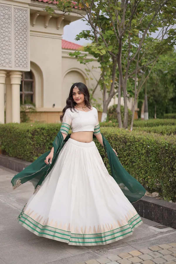Comfortable_&_lightweight_white_Viscose_Jacquard_Lehenga_Choli_with_Dupatta,_perfect_for_your_Onam_festive_wardrobe._Elegant,_graceful_&_easy_to_wear_�_comes_with_an_unstitched_blouse_for_a_custom_fit.