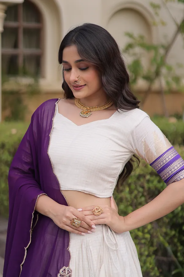 Comfortable_&_lightweight_white_Viscose_Jacquard_Lehenga_Choli_with_Dupatta,_perfect_for_your_Onam_festive_wardrobe._Elegant,_graceful_&_easy_to_wear_�_comes_with_an_unstitched_blouse_for_a_custom_fit.