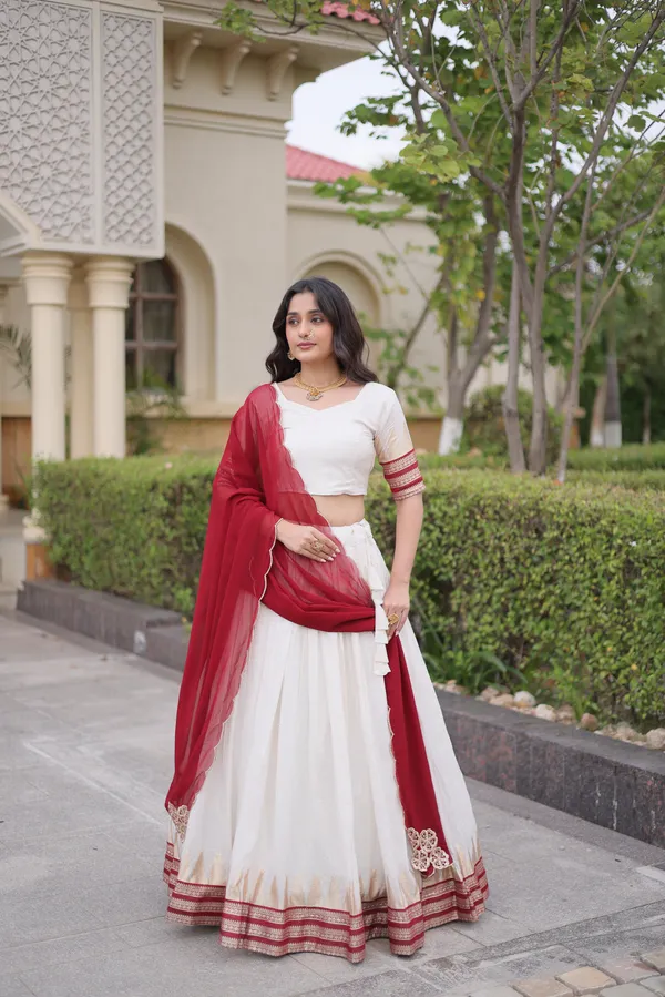 Comfortable_&_lightweight_white_Viscose_Jacquard_Lehenga_Choli_with_Dupatta,_perfect_for_your_Onam_festive_wardrobe._Elegant,_graceful_&_easy_to_wear_�_comes_with_an_unstitched_blouse_for_a_custom_fit.