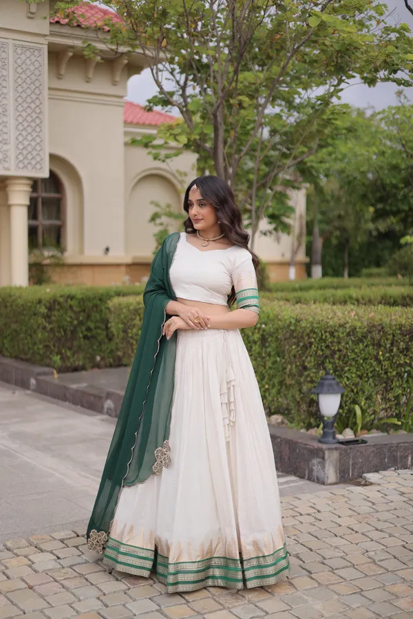 Comfortable_&_lightweight_white_Viscose_Jacquard_Lehenga_Choli_with_Dupatta,_perfect_for_your_Onam_festive_wardrobe._Elegant,_graceful_&_easy_to_wear_�_comes_with_an_unstitched_blouse_for_a_custom_fit.