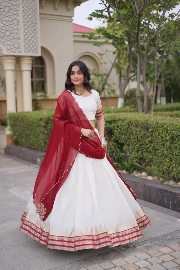 Comfortable_&_lightweight_white_Viscose_Jacquard_Lehenga_Choli_with_Dupatta,_perfect_for_your_Onam_festive_wardrobe._Elegant,_graceful_&_easy_to_wear_�_comes_with_an_unstitched_blouse_for_a_custom_fit.