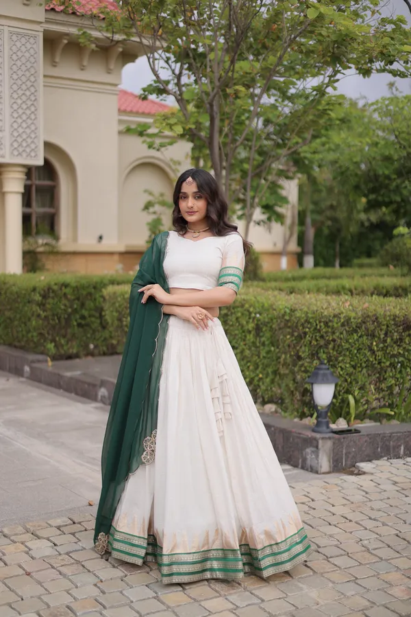 Comfortable_&_lightweight_white_Viscose_Jacquard_Lehenga_Choli_with_Dupatta,_perfect_for_your_Onam_festive_wardrobe._Elegant,_graceful_&_easy_to_wear_�_comes_with_an_unstitched_blouse_for_a_custom_fit.
