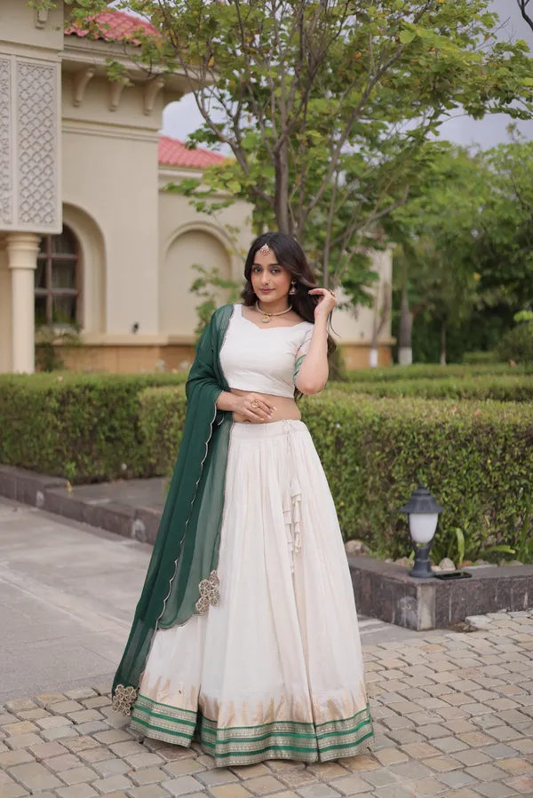 Comfortable_&_lightweight_white_Viscose_Jacquard_Lehenga_Choli_with_Dupatta,_perfect_for_your_Onam_festive_wardrobe._Elegant,_graceful_&_easy_to_wear_�_comes_with_an_unstitched_blouse_for_a_custom_fit.