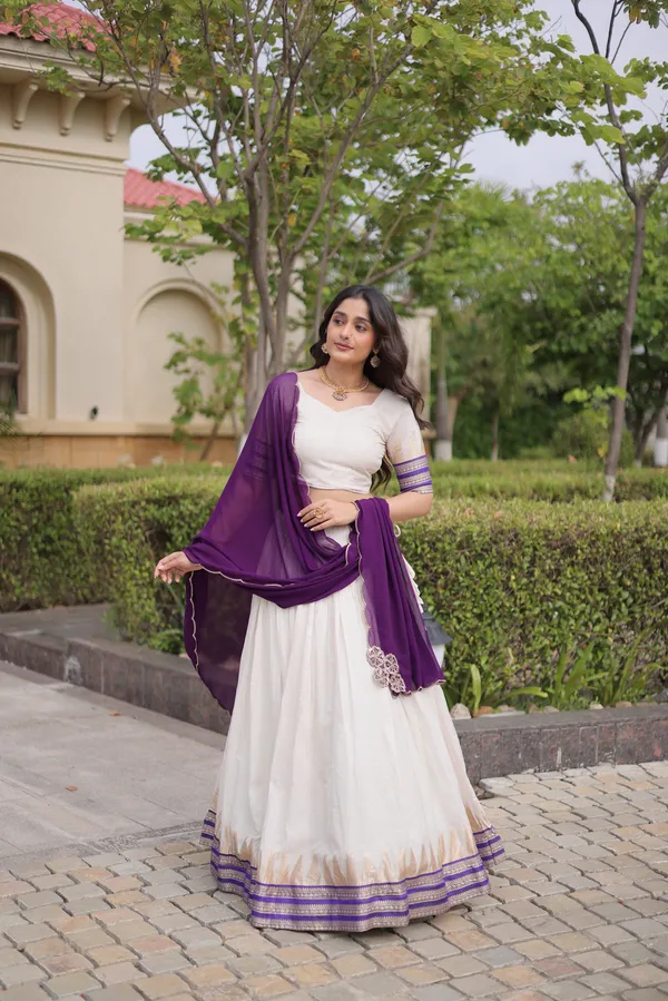 Comfortable_&_lightweight_white_Viscose_Jacquard_Lehenga_Choli_with_Dupatta,_perfect_for_your_Onam_festive_wardrobe._Elegant,_graceful_&_easy_to_wear_�_comes_with_an_unstitched_blouse_for_a_custom_fit.