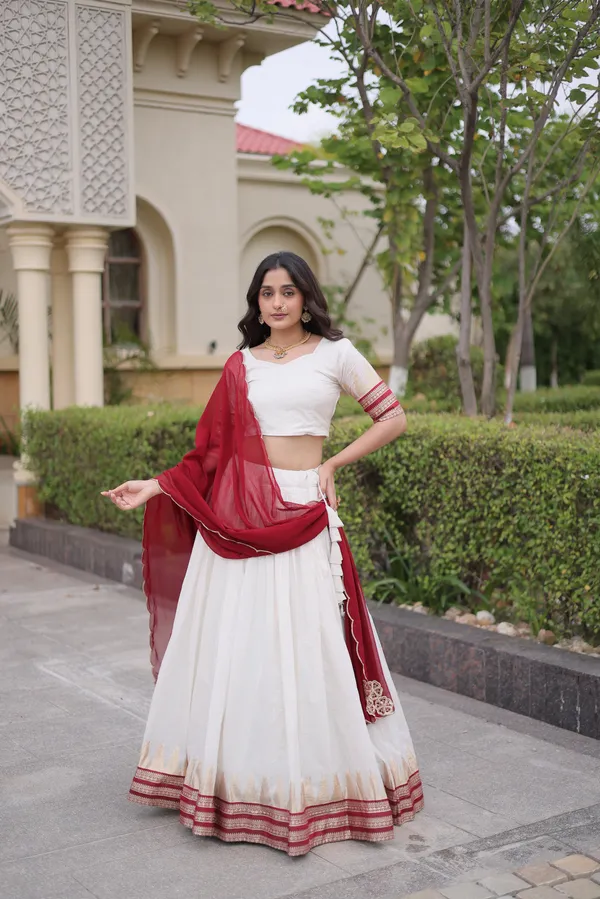 Comfortable_&_lightweight_white_Viscose_Jacquard_Lehenga_Choli_with_Dupatta,_perfect_for_your_Onam_festive_wardrobe._Elegant,_graceful_&_easy_to_wear_�_comes_with_an_unstitched_blouse_for_a_custom_fit.