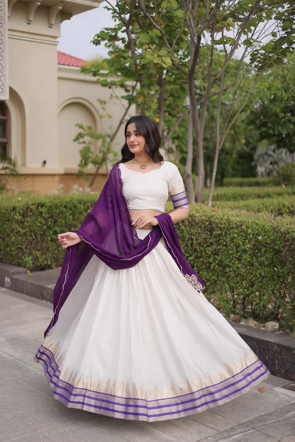 Comfortable_&_lightweight_white_Viscose_Jacquard_Lehenga_Choli_with_Dupatta,_perfect_for_your_Onam_festive_wardrobe._Elegant,_graceful_&_easy_to_wear_�_comes_with_an_unstitched_blouse_for_a_custom_fit.