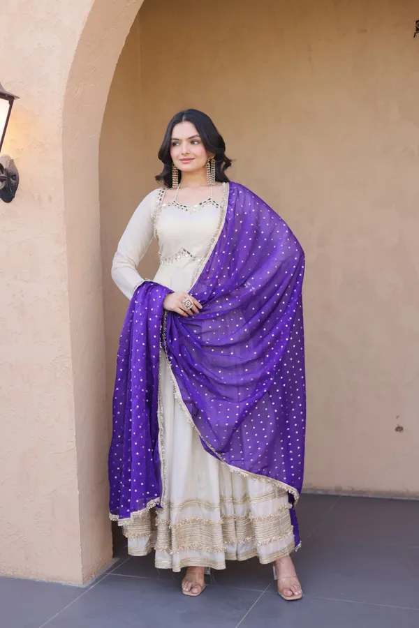 Cosmos_Lehenga_designed_with_real_mirror_and_zari_embroidered_lace_work,_giving_a_rich_and_festive_look._Comes_with_a_stitched_blouse_and_available_in_sizes_�_perfect_for_Navratri_&_celebrations.