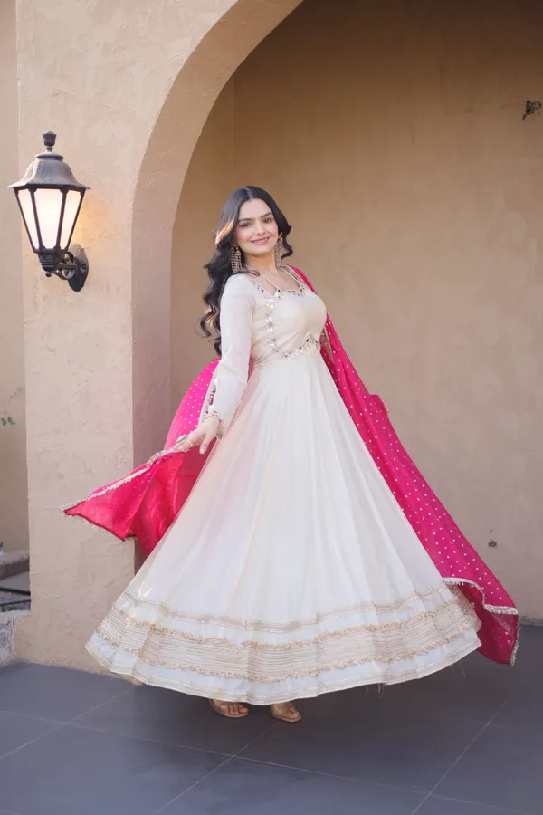 Cosmos_Lehenga_designed_with_real_mirror_and_zari_embroidered_lace_work,_giving_a_rich_and_festive_look._Comes_with_a_stitched_blouse_and_available_in_sizes_�_perfect_for_Navratri_&_celebrations.