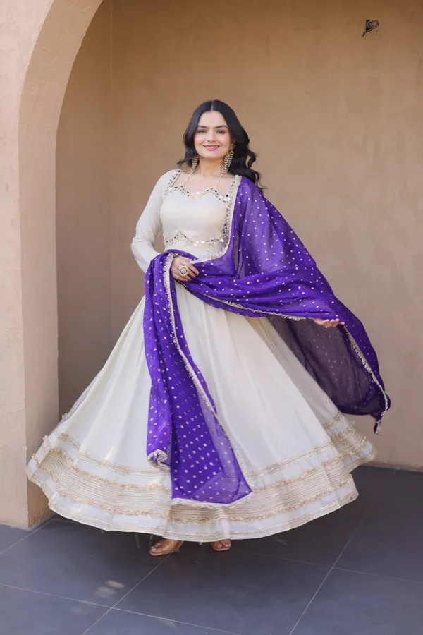 Cosmos_Lehenga_designed_with_real_mirror_and_zari_embroidered_lace_work,_giving_a_rich_and_festive_look._Comes_with_a_stitched_blouse_and_available_in_sizes_�_perfect_for_Navratri_&_celebrations.