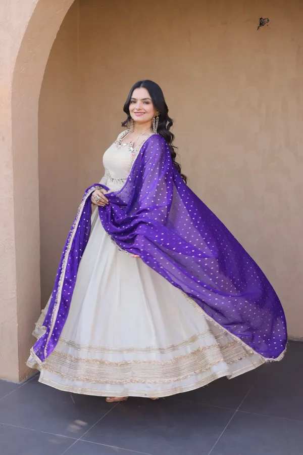 Cosmos_Lehenga_designed_with_real_mirror_and_zari_embroidered_lace_work,_giving_a_rich_and_festive_look._Comes_with_a_stitched_blouse_and_available_in_sizes_�_perfect_for_Navratri_&_celebrations.