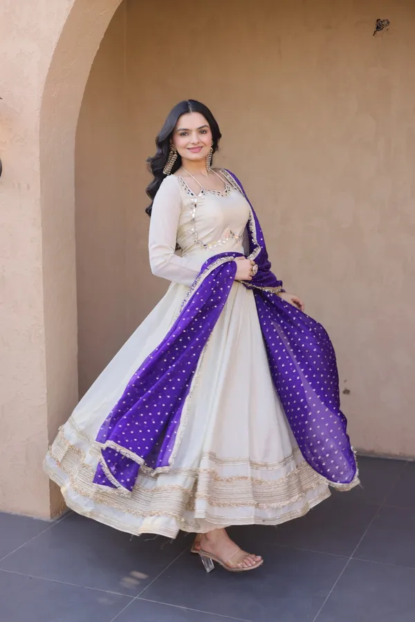 Cosmos_Lehenga_designed_with_real_mirror_and_zari_embroidered_lace_work,_giving_a_rich_and_festive_look._Comes_with_a_stitched_blouse_and_available_in_sizes_�_perfect_for_Navratri_&_celebrations.
